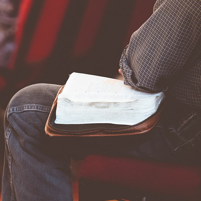 Man in church with open bible